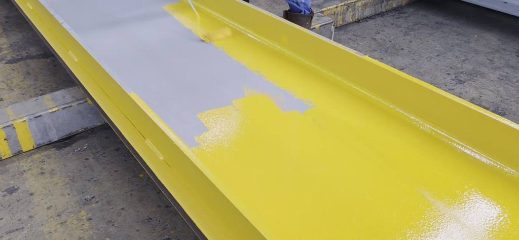 Finishing a painted crane runway beam at Toptek
