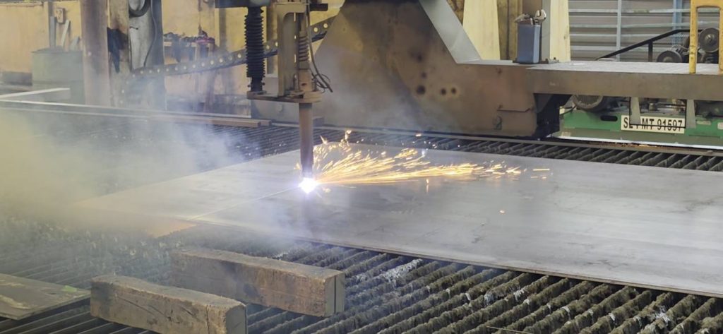 CNC cutting table in operation at Toptek Port Klang plant